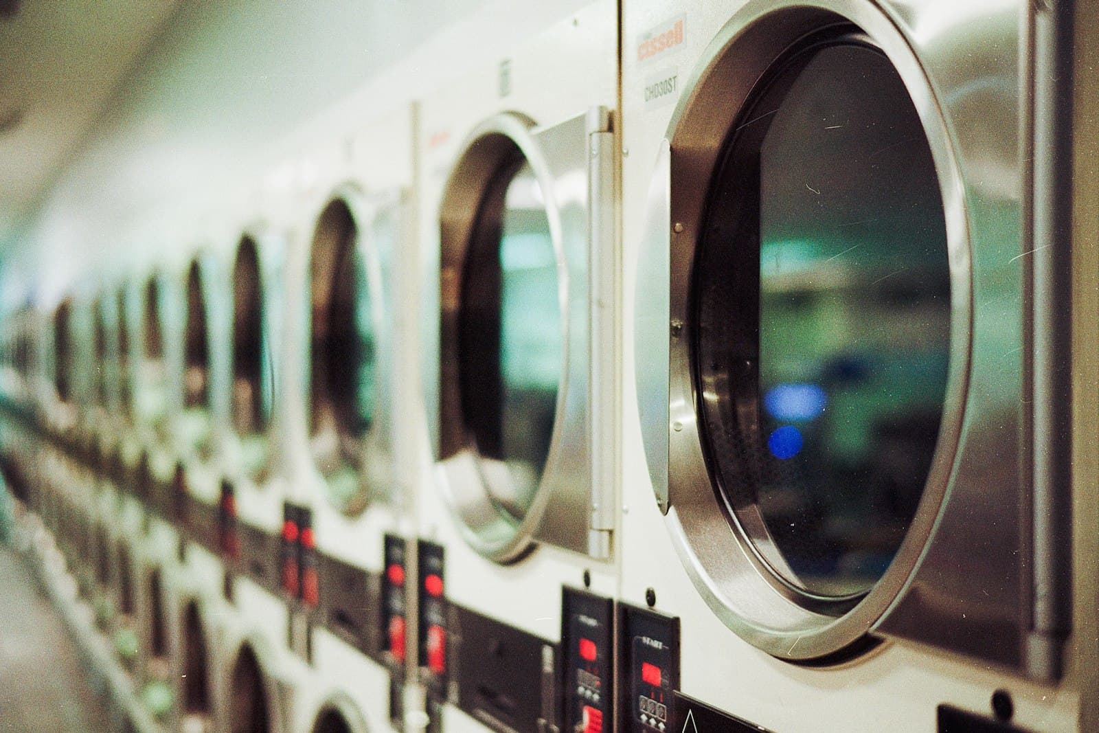 Row of professional laundry machines at the Indrajit care facility